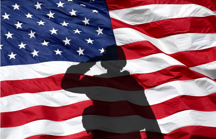 Hometown Heros Soldier soluting the American flag
