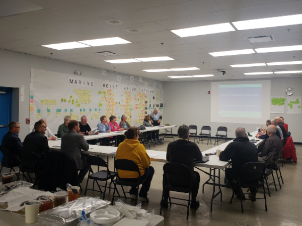 people seated at tables for meeting